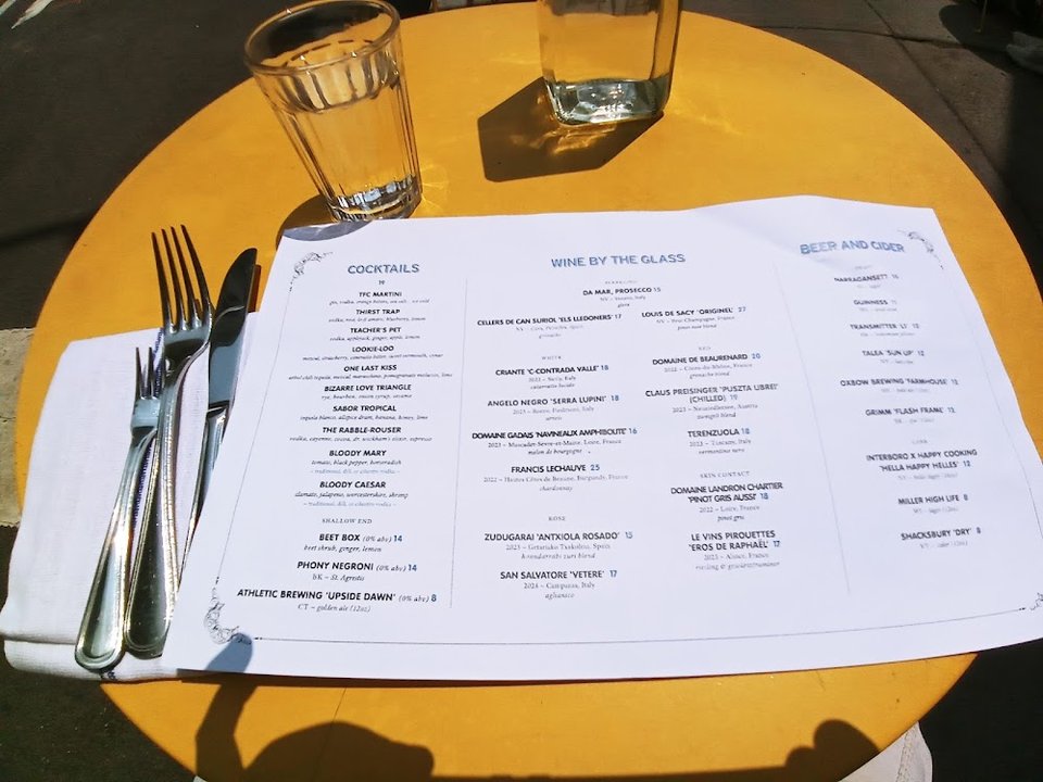Printed menu showing oysters and seafood dishes